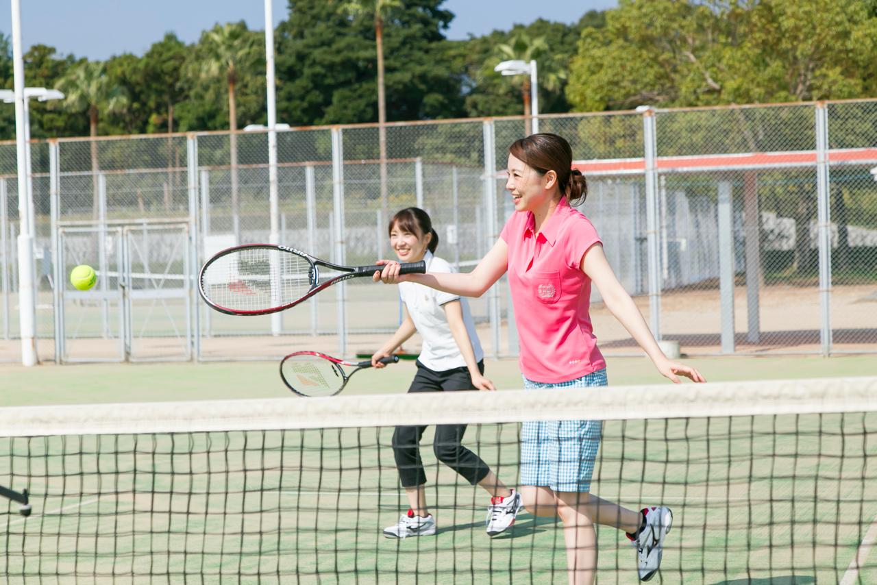 Two women playing tennis